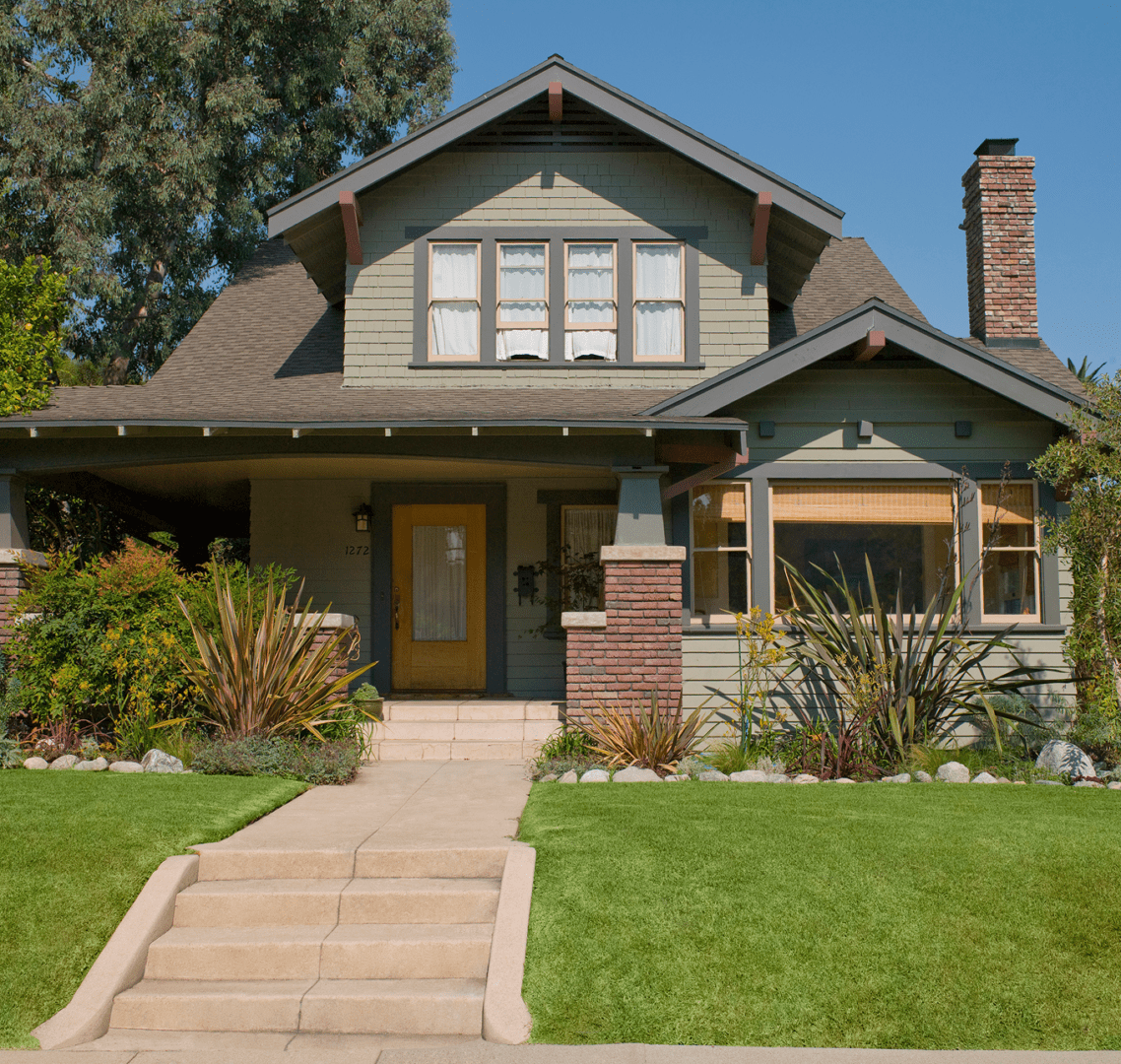 Craftsman-style house with sunny front yard